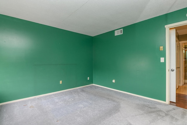 65 Heritage Vlg Unit B, Southbury, CT 06488 - carpeted spare room featuring baseboards