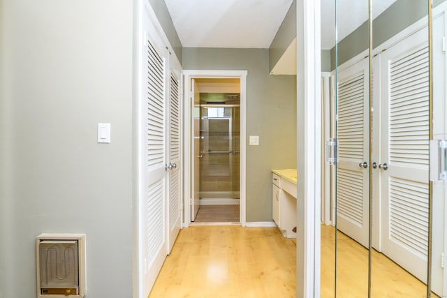 65 Heritage Vlg Unit B, Southbury, CT 06488 - hallway featuring light wood-style flooring