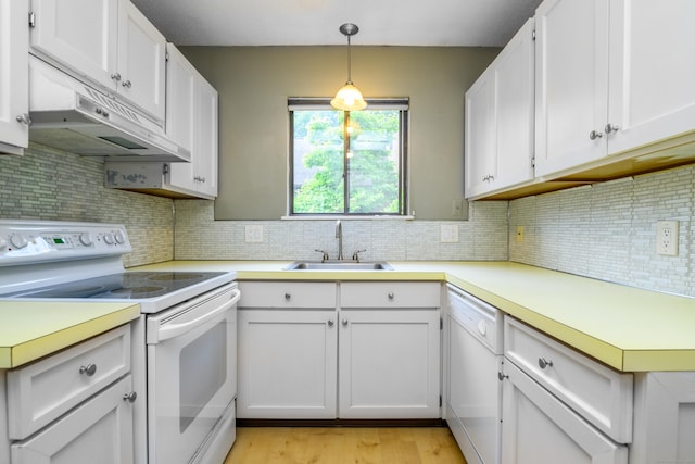 65 Heritage Vlg Unit B, Southbury, CT 06488 - kitchen with white appliances, under cabinet range hood, and light countertops