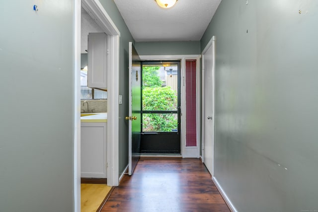 65 Heritage Vlg Unit B, Southbury, CT 06488 - doorway with wood finished floors and a textured ceiling