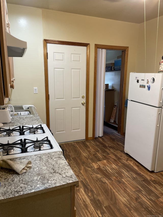 90 Olive St, Bridgeport, CT 06605 - kitchen featuring white appliances, ventilation hood, and dark wood-style flooring