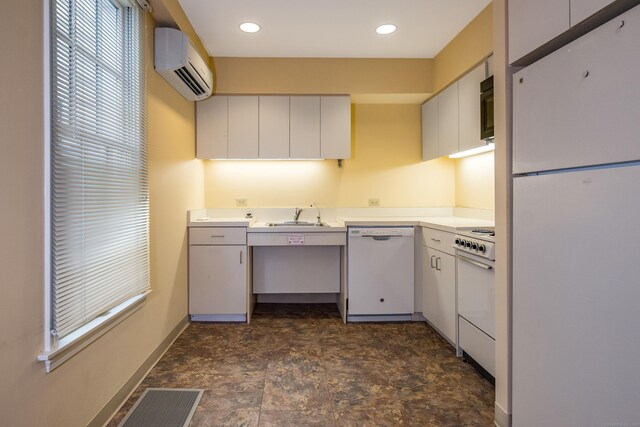 3 Essex Sq, Essex, CT 06426 - kitchen with white appliances, a wall mounted air conditioner, light countertops, white cabinetry, and stone finish flooring