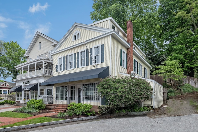 3 Essex Sq, Essex, CT 06426 - view of front facade featuring a chimney and a balcony