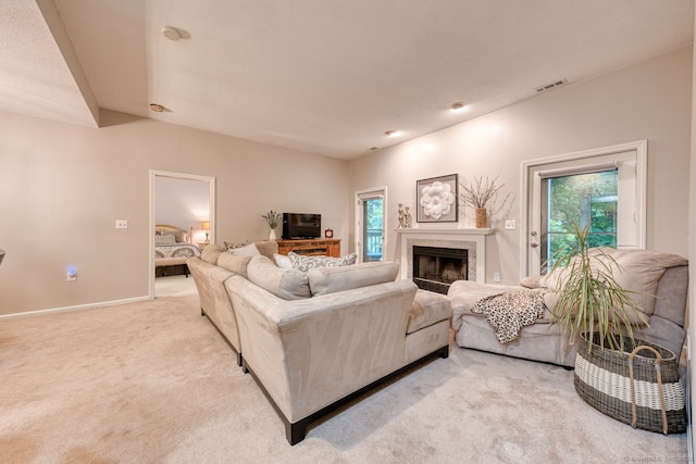33 Langdon Ct Apt Cl4, Berlin, CT 06037 - carpeted living room featuring a fireplace and baseboards