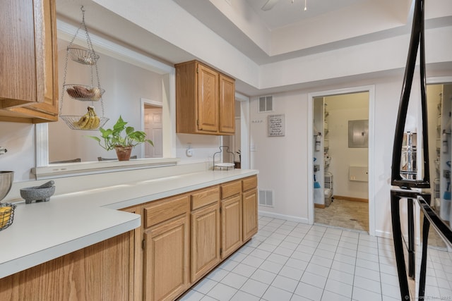 33 Langdon Ct Apt Cl4, Berlin, CT 06037 - kitchen featuring light countertops, light tile patterned flooring, electric panel, and a ceiling fan