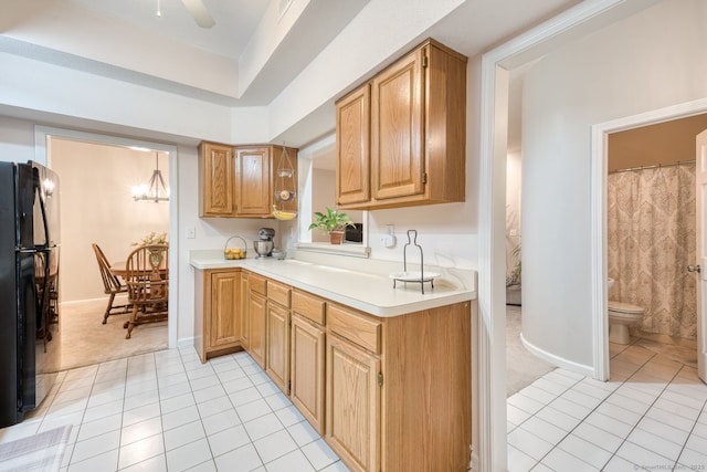 33 Langdon Ct Apt Cl4, Berlin, CT 06037 - kitchen with freestanding refrigerator, light tile patterned floors, light countertops, and light colored carpet