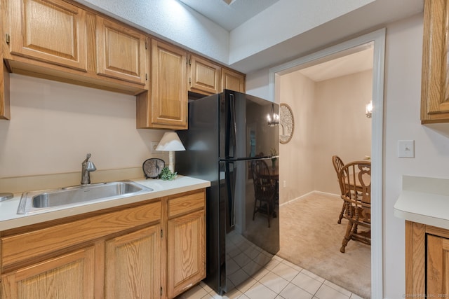 33 Langdon Ct Apt Cl4, Berlin, CT 06037 - kitchen with freestanding refrigerator, light colored carpet, light countertops, and light tile patterned floors
