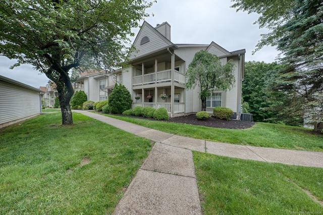 33 Langdon Ct Apt Cl4, Berlin, CT 06037 - view of front of property featuring a front lawn, a balcony, and a chimney