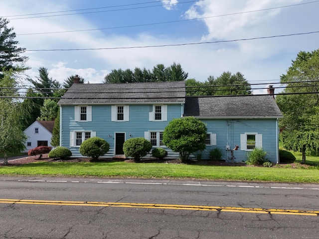 491 Main St, Somers, CT 06071 - colonial inspired home with a chimney, a front lawn, and a shingled roof