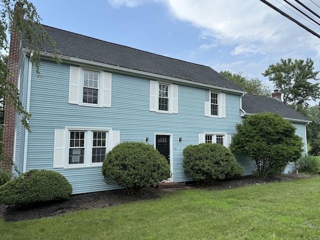 491 Main St, Somers, CT 06071 - view of front of home featuring a front lawn and a chimney