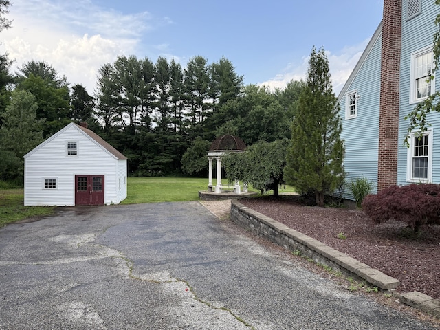491 Main St, Somers, CT 06071 - view of patio featuring an outdoor structure and asphalt driveway