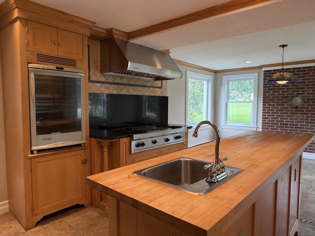 491 Main St, Somers, CT 06071 - kitchen featuring butcher block counters, wall chimney exhaust hood, wine cooler, decorative backsplash, and a kitchen island with sink