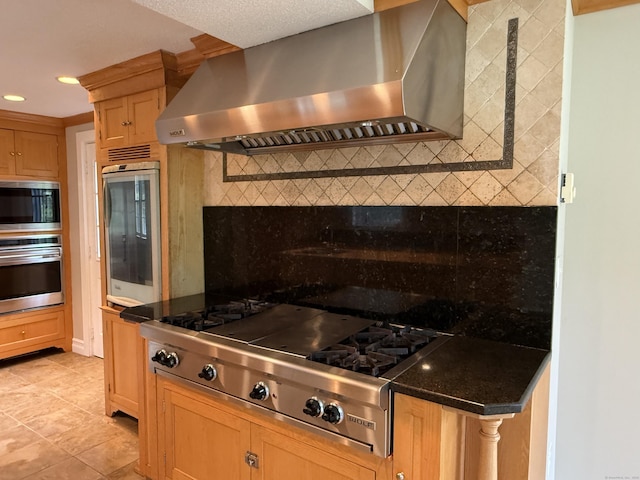 491 Main St, Somers, CT 06071 - kitchen with wall chimney range hood, appliances with stainless steel finishes, backsplash, light tile patterned floors, and recessed lighting