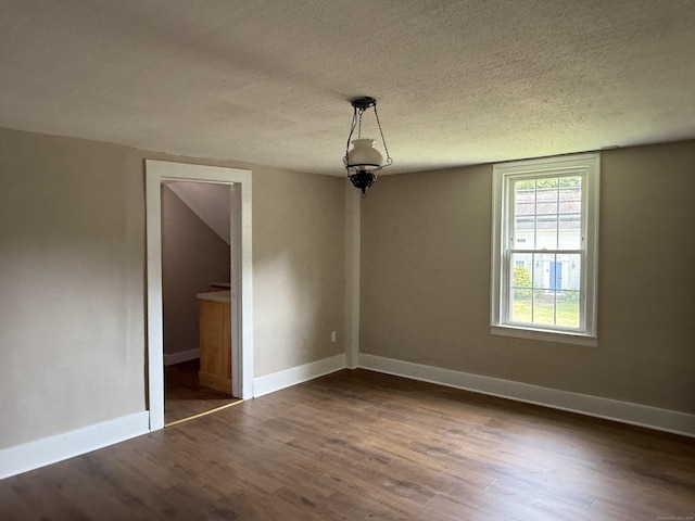 491 Main St, Somers, CT 06071 - unfurnished room with dark wood finished floors and a textured ceiling