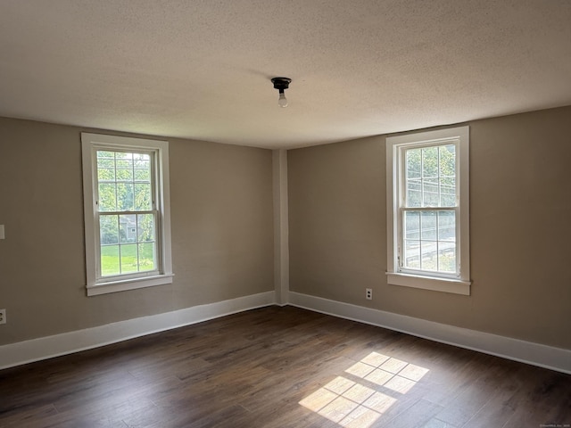 491 Main St, Somers, CT 06071 - unfurnished room featuring a textured ceiling and dark wood-style floors