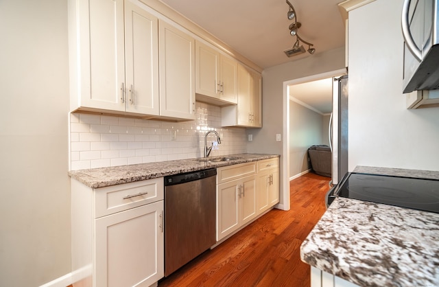 19 Heather Ct Unit 19, Cromwell, CT 06416 - kitchen with stainless steel dishwasher, backsplash, light wood finished floors, light stone counters, and crown molding