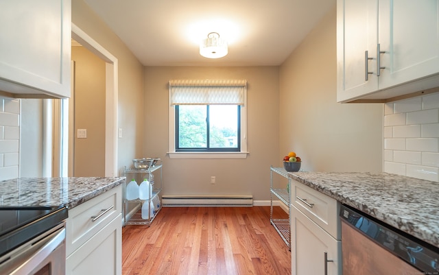 19 Heather Ct Unit 19, Cromwell, CT 06416 - kitchen featuring stainless steel dishwasher, light wood finished floors, a baseboard heating unit, and white cabinetry