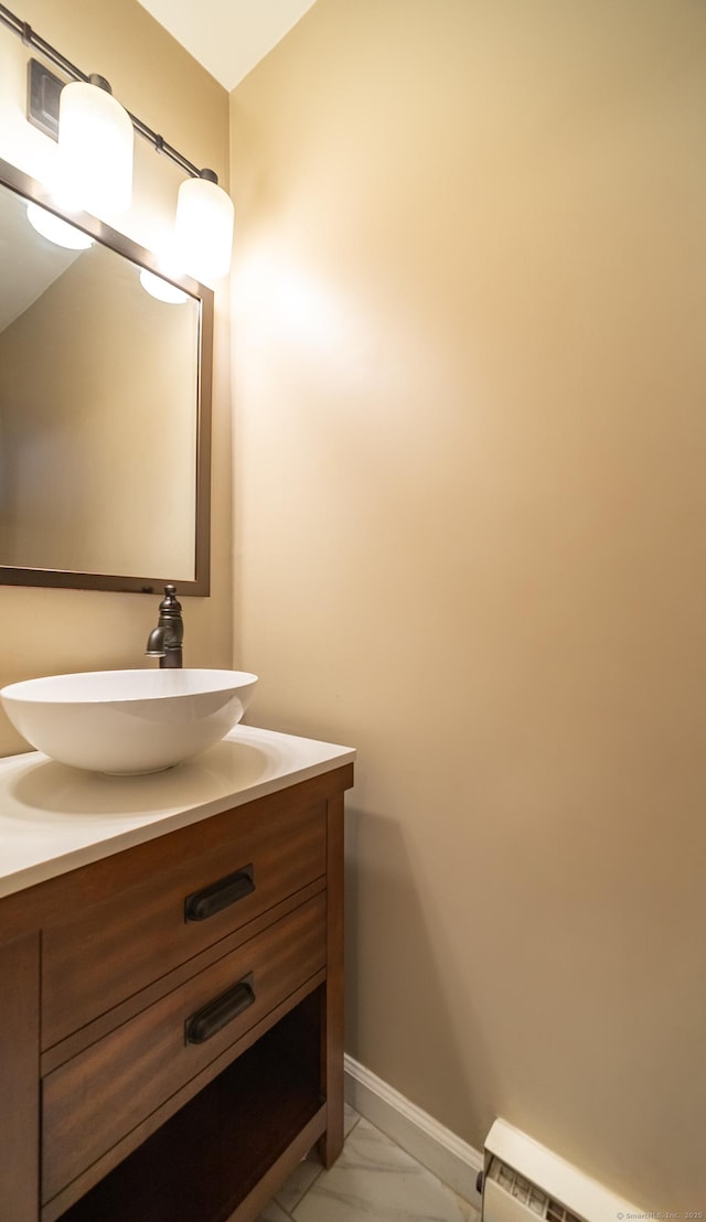 19 Heather Ct Unit 19, Cromwell, CT 06416 - bathroom featuring vanity, baseboard heating, and marble look tile flooring