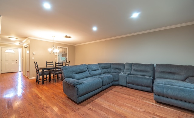 19 Heather Ct Unit 19, Cromwell, CT 06416 - living room with light wood finished floors, ornamental molding, and a chandelier