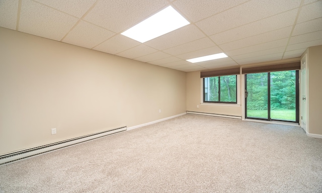 19 Heather Ct Unit 19, Cromwell, CT 06416 - empty room featuring a baseboard heating unit, baseboard heating, carpet floors, and a paneled ceiling