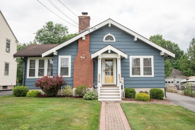 67 Nott St, Wethersfield, CT 06109 - bungalow-style home featuring a chimney, a front yard, and entry steps
