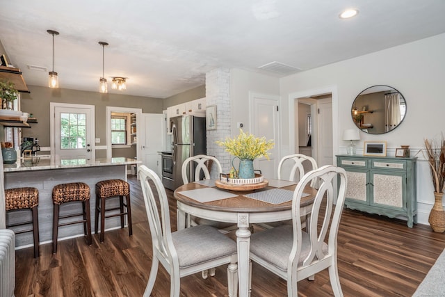 67 Nott St, Wethersfield, CT 06109 - dining room featuring dark wood-style floors, radiator heating unit, and recessed lighting