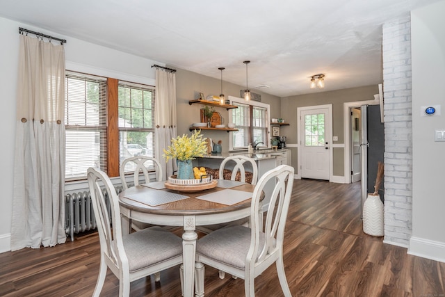 67 Nott St, Wethersfield, CT 06109 - dining area with radiator and dark wood-style floors