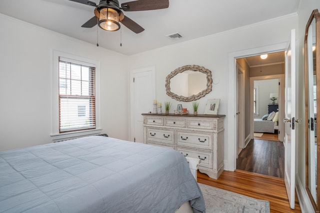 67 Nott St, Wethersfield, CT 06109 - bedroom with wood finished floors, crown molding, and ceiling fan