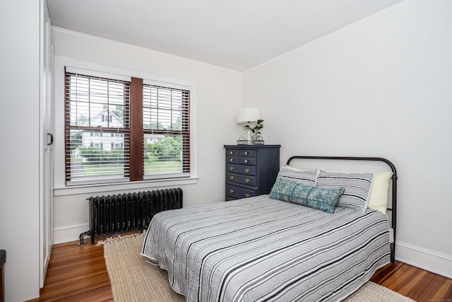 67 Nott St, Wethersfield, CT 06109 - bedroom with radiator heating unit, wood finished floors, and crown molding
