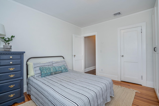 67 Nott St, Wethersfield, CT 06109 - bedroom featuring wood finished floors and ornamental molding