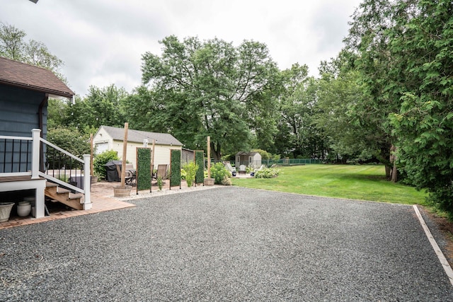 67 Nott St, Wethersfield, CT 06109 - view of yard featuring a storage unit and view of scattered trees