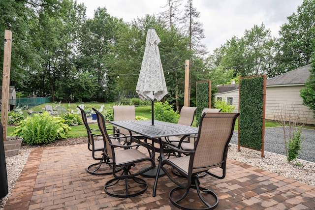 67 Nott St, Wethersfield, CT 06109 - view of patio featuring outdoor dining area and view of scattered trees