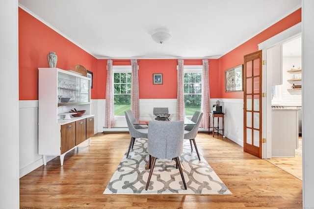 31 Stable Ridge Rd, Monroe, CT 06468 - dining room featuring ornamental molding, light wood-style flooring, plenty of natural light, a wainscoted wall, and a baseboard heating unit
