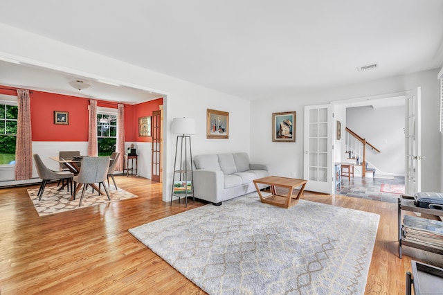 31 Stable Ridge Rd, Monroe, CT 06468 - living area with healthy amount of natural light, french doors, and light wood finished floors