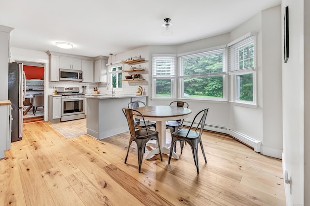 31 Stable Ridge Rd, Monroe, CT 06468 - dining room featuring a baseboard radiator and light wood-style floors