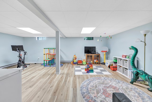 31 Stable Ridge Rd, Monroe, CT 06468 - rec room with a drop ceiling and wood finished floors