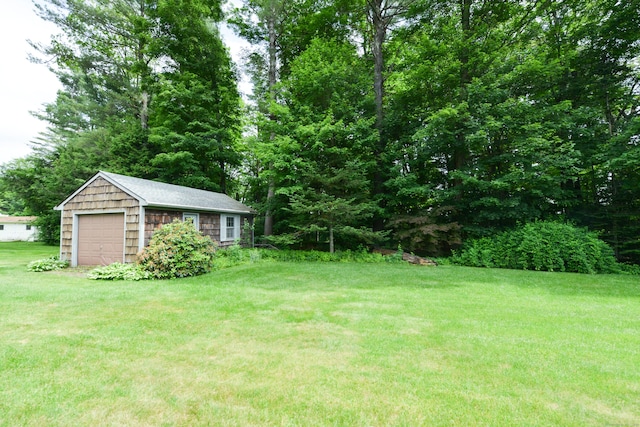 110 Woodfield Rd, Bristol, CT 06010 - view of green lawn featuring a detached garage and an outdoor structure