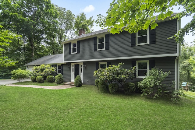 109 Hemlock Dr, Killingworth, CT 06419 - colonial house featuring a chimney, a front yard, concrete driveway, and an attached garage