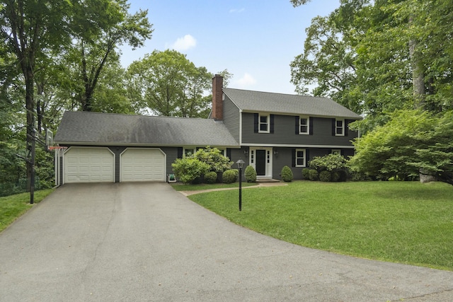 109 Hemlock Dr, Killingworth, CT 06419 - colonial-style house featuring an attached garage, driveway, a chimney, a front lawn, and roof with shingles