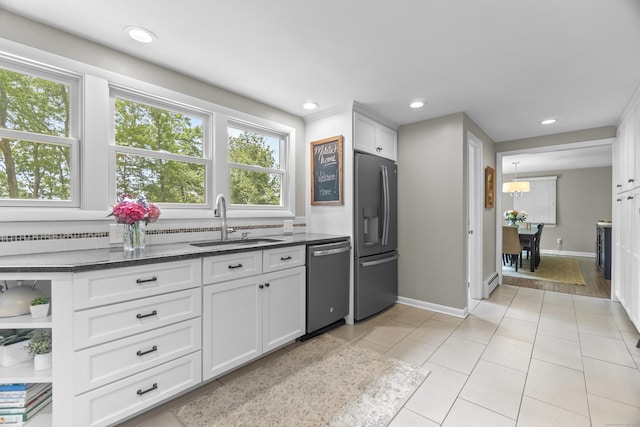109 Hemlock Dr, Killingworth, CT 06419 - kitchen featuring stainless steel appliances, healthy amount of natural light, white cabinets, light tile patterned floors, and recessed lighting