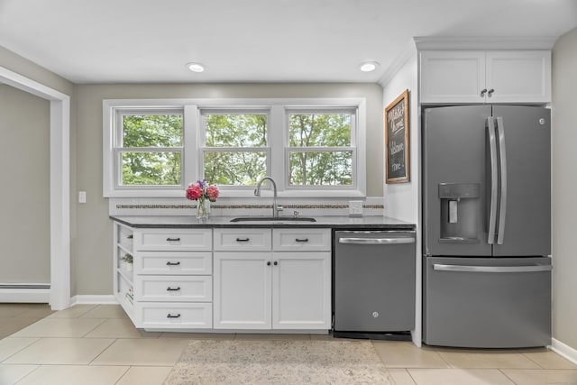 109 Hemlock Dr, Killingworth, CT 06419 - kitchen featuring stainless steel appliances, baseboard heating, light tile patterned flooring, white cabinetry, and recessed lighting