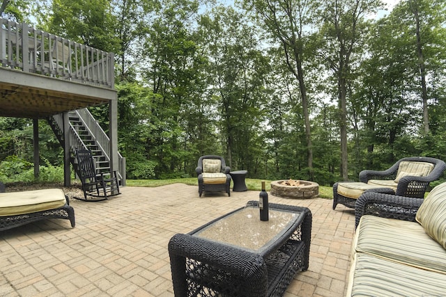 109 Hemlock Dr, Killingworth, CT 06419 - view of patio / terrace with a fire pit, stairway, a wooden deck, and view of wooded area