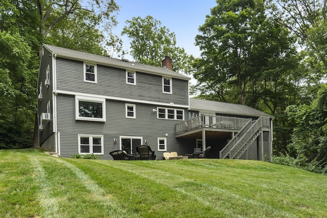 109 Hemlock Dr, Killingworth, CT 06419 - rear view of house featuring a chimney, a deck, stairway, and a lawn