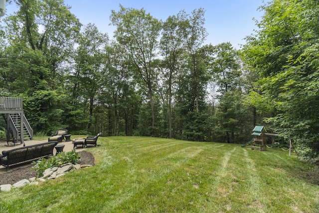 109 Hemlock Dr, Killingworth, CT 06419 - view of grassy yard with a playground, an outdoor hangout area, a patio area, and stairs