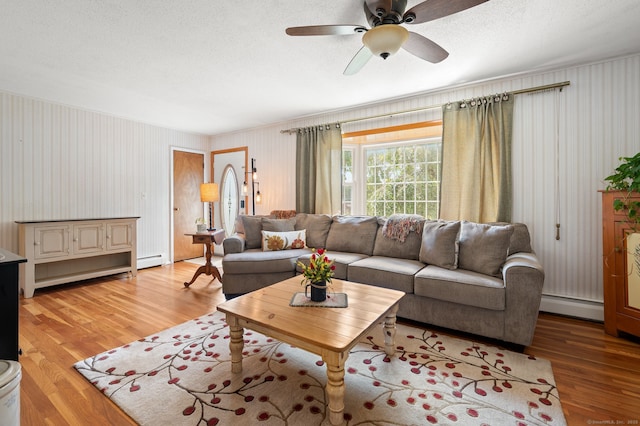 43 Dimmock Rd, Waterford, CT 06385 - living room with light wood-style flooring, baseboard heating, and ceiling fan