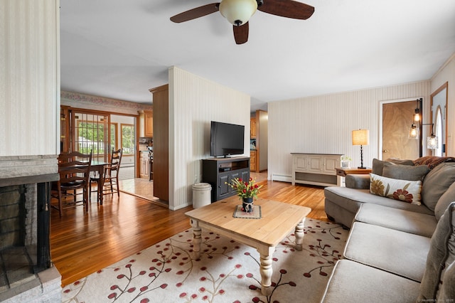 43 Dimmock Rd, Waterford, CT 06385 - living area featuring wallpapered walls, light wood-style flooring, and a ceiling fan