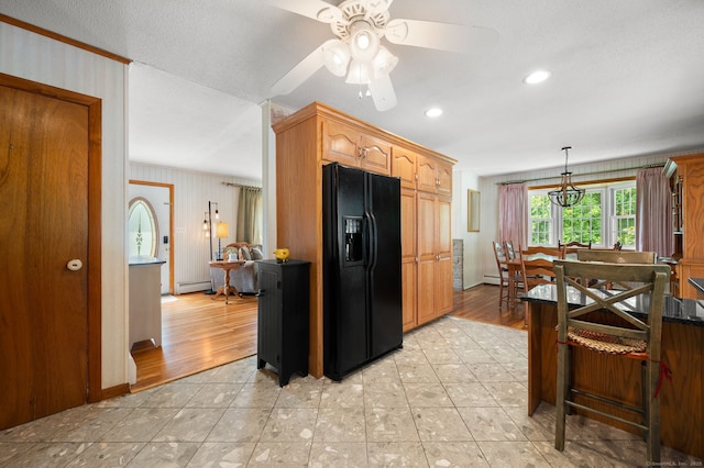 43 Dimmock Rd, Waterford, CT 06385 - kitchen with black refrigerator with ice dispenser, a baseboard heating unit, a ceiling fan, pendant lighting, and light tile patterned flooring