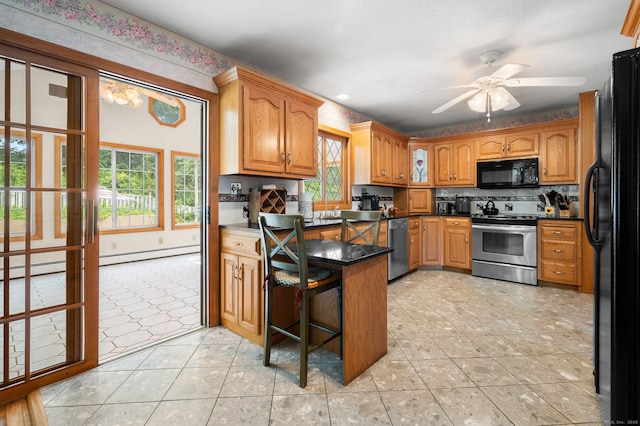 43 Dimmock Rd, Waterford, CT 06385 - kitchen with black appliances, a peninsula, healthy amount of natural light, ceiling fan, and recessed lighting