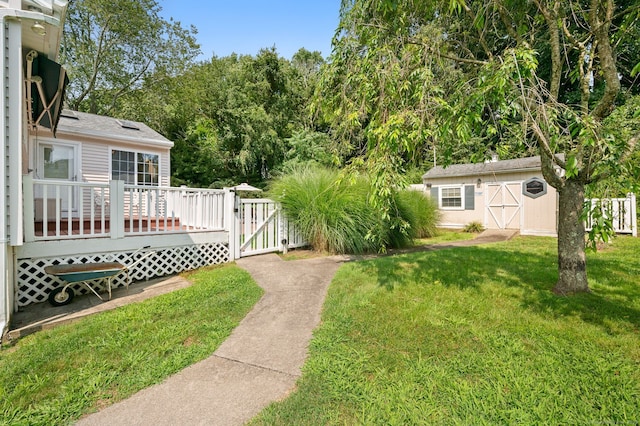 43 Dimmock Rd, Waterford, CT 06385 - view of yard featuring a gate, a wooden deck, and a storage shed