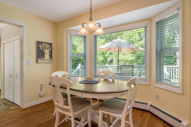 10 Oak Dr, Essex, CT 06409 - dining space with wood finished floors, a chandelier, and baseboard heating